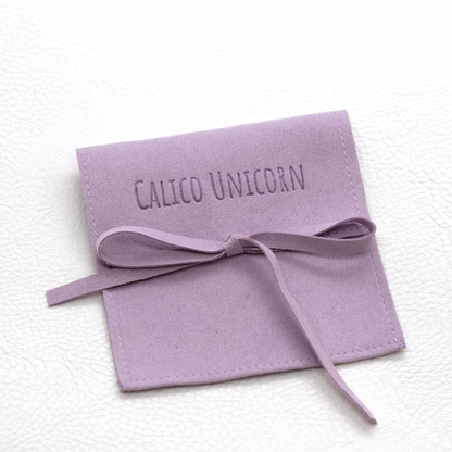 Calico Unicorn jewelry pouch.png